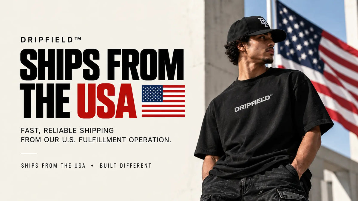 A man wearing a black Dripfield t-shirt and black cap stands outdoors next to a large American flag, with promotional text on the left reading 'DRIPFIELD SHIPS FROM THE USA'.